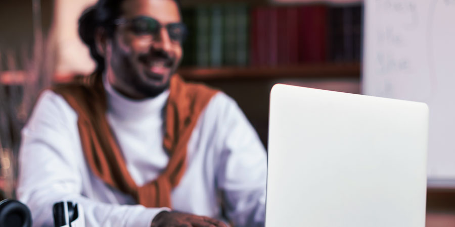 Man watching webinar in home