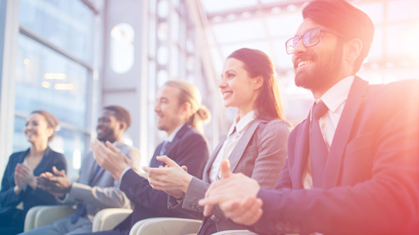 People clapping at corporate event. People clapping at corporate event.